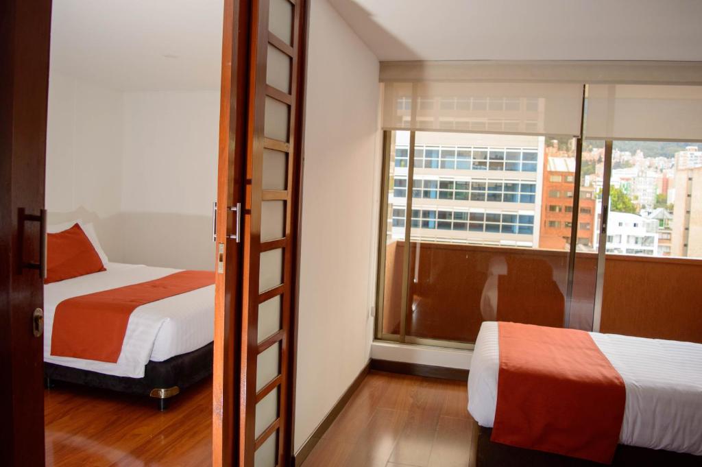 Postel nebo postele na pokoji v ubytování Hotel Confort 80 Zona Rosa