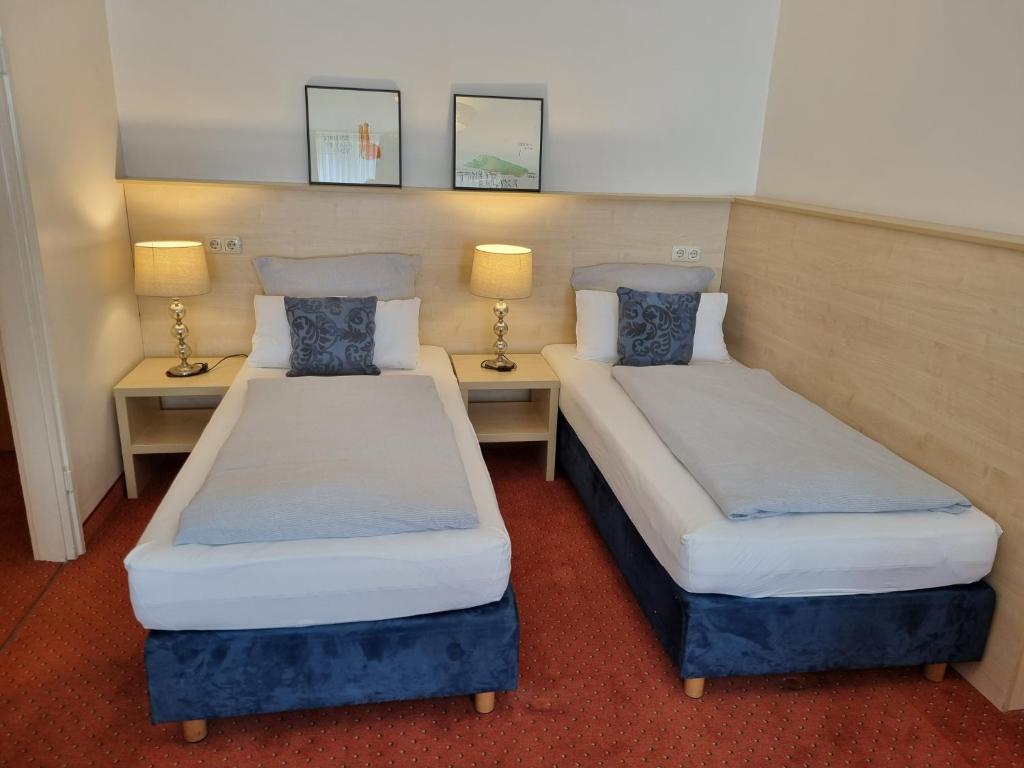 Postel nebo postele na pokoji v ubytování myMINGA13 - Hotel & serviced Apartments