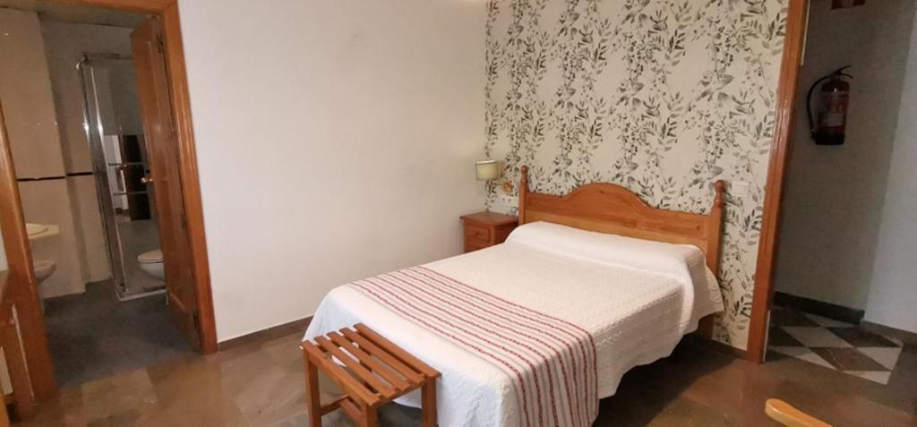 Postel nebo postele na pokoji v ubytování Hotel Corona de Atarfe