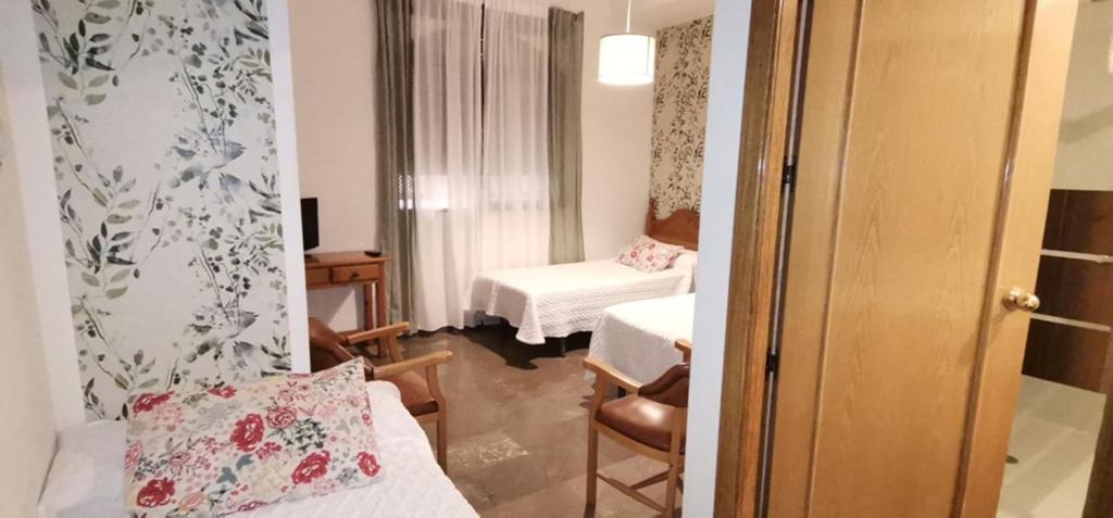 Postel nebo postele na pokoji v ubytování Hotel Corona de Atarfe