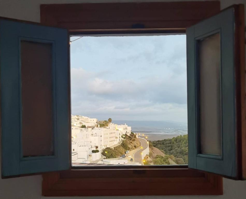 a window with a view of a building at Holiday home La Atalaya de Vejer in Vejer de la Frontera