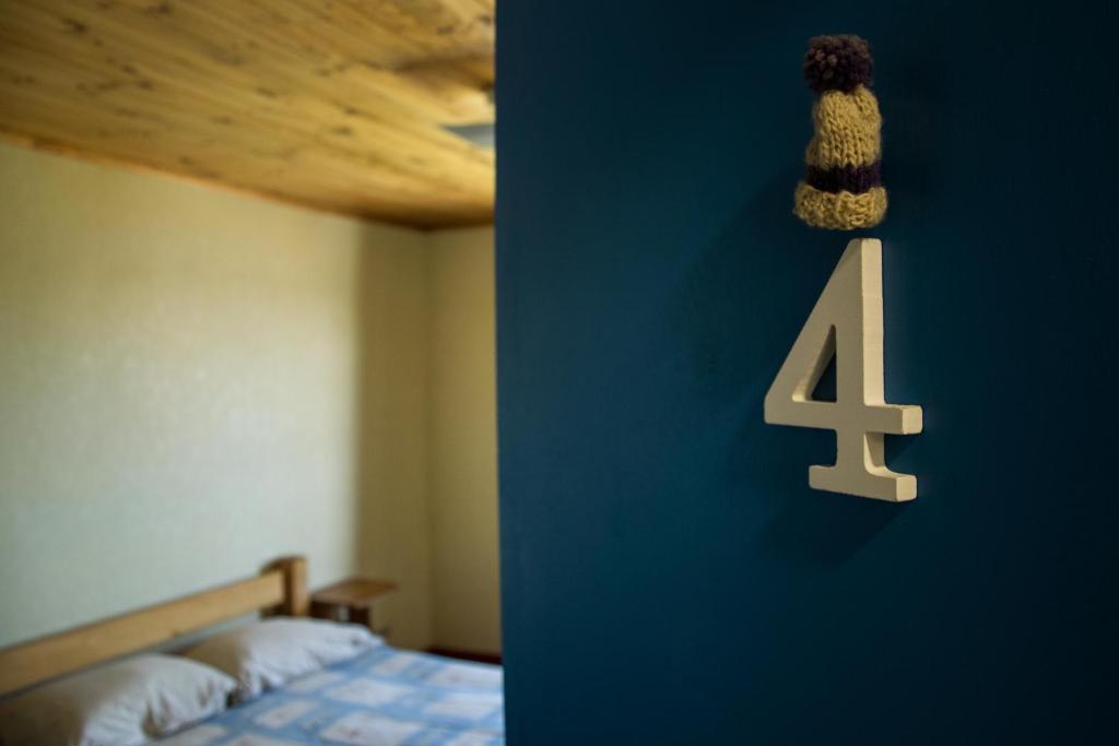 Postel nebo postele na pokoji v ubytování Hostal Mundo Nuevo