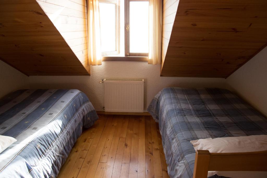 Postel nebo postele na pokoji v ubytování Hostal Mundo Nuevo