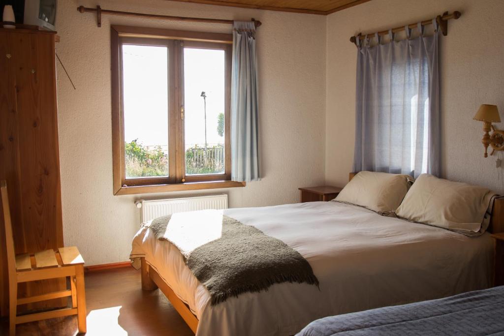 Postel nebo postele na pokoji v ubytování Hostal Mundo Nuevo