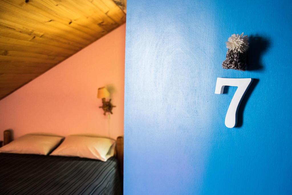 Postel nebo postele na pokoji v ubytování Hostal Mundo Nuevo