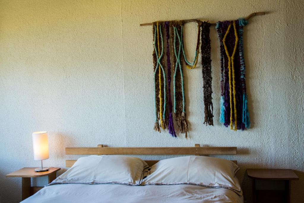 Postel nebo postele na pokoji v ubytování Hostal Mundo Nuevo