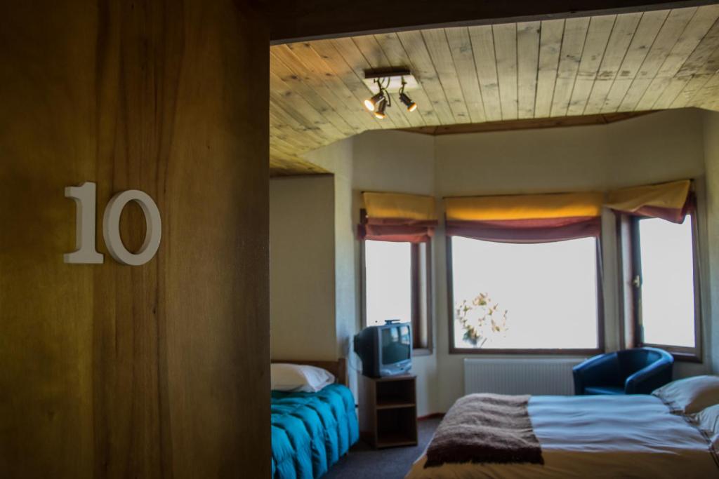 Postel nebo postele na pokoji v ubytování Hostal Mundo Nuevo