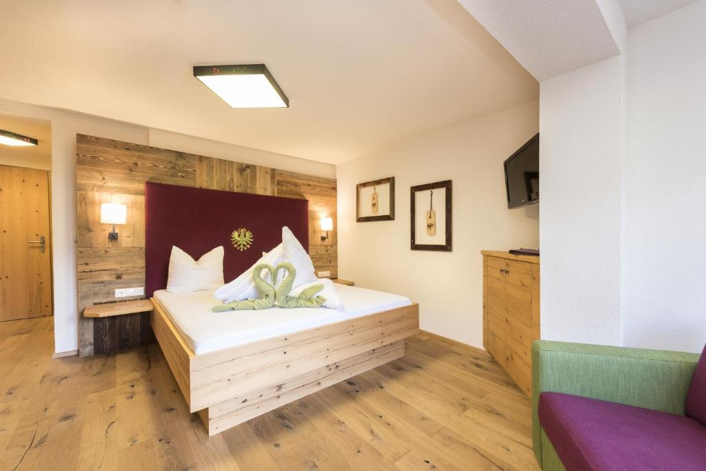 Postel nebo postele na pokoji v ubytování Pure PanoramaHotel Erika Superior