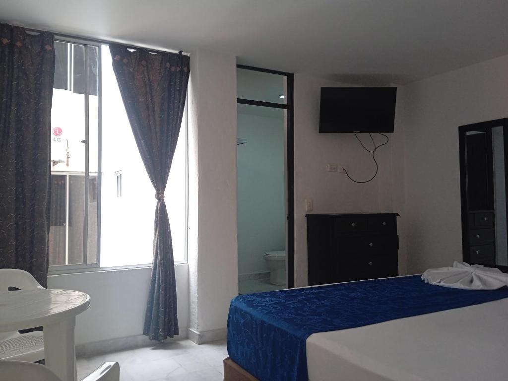 Postel nebo postele na pokoji v ubytování Blue Star Hotel