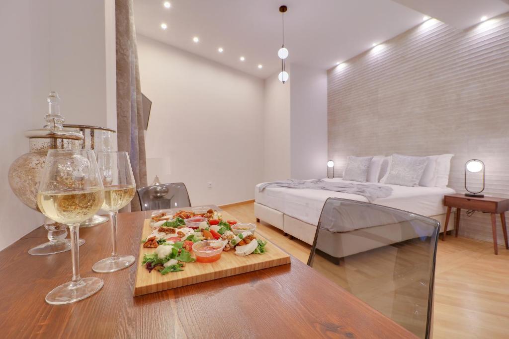 Postel nebo postele na pokoji v ubytování AthINN Residence