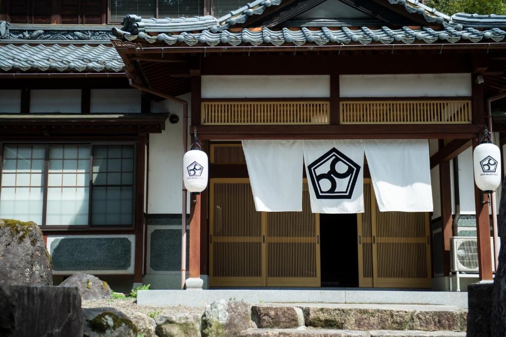a building with a gate with white towels on it at SABAE MEGANE HOUSE- Vacation STAY 5077 in Sabae