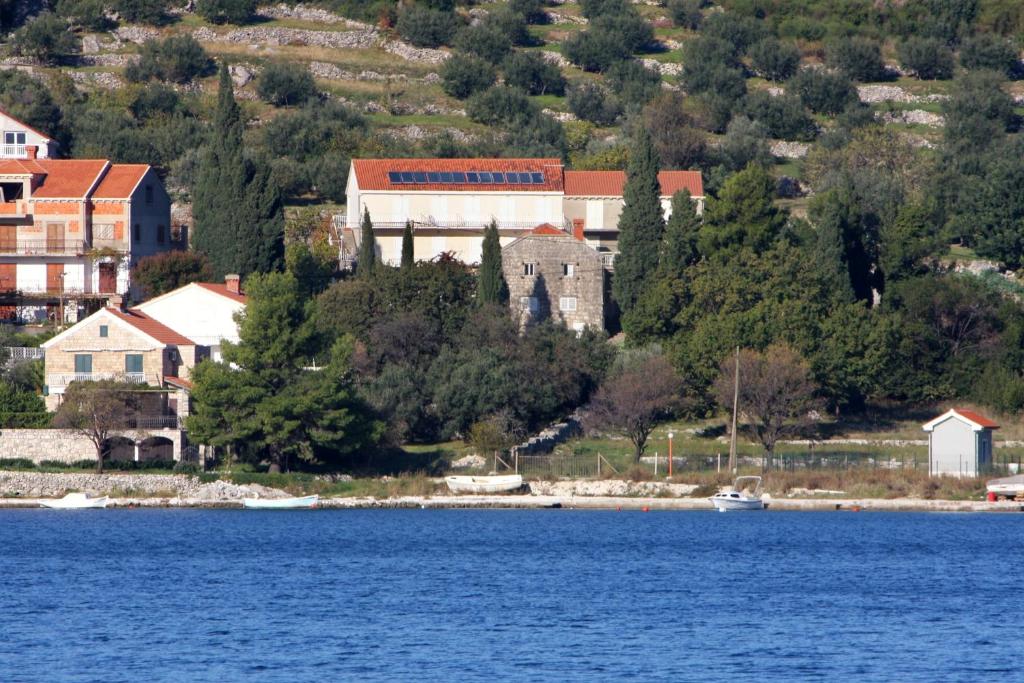 a town on the shore of a body of water at Apartments and rooms by the sea Slano, Dubrovnik - 2682 in Slano