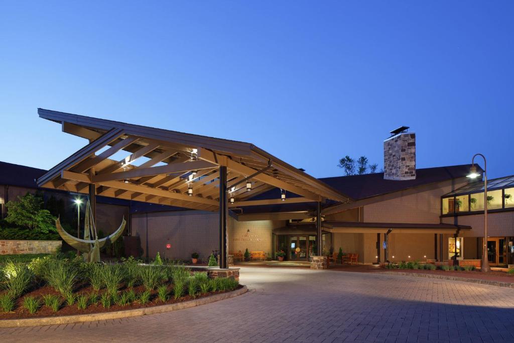 a large building with lights on it at night at Chauncey Hotel and Conference Center in Princeton