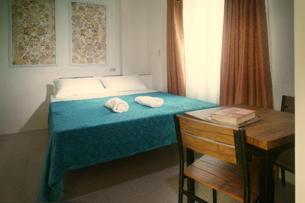 Postel nebo postele na pokoji v ubytování 1001 Nights Boutique Inn