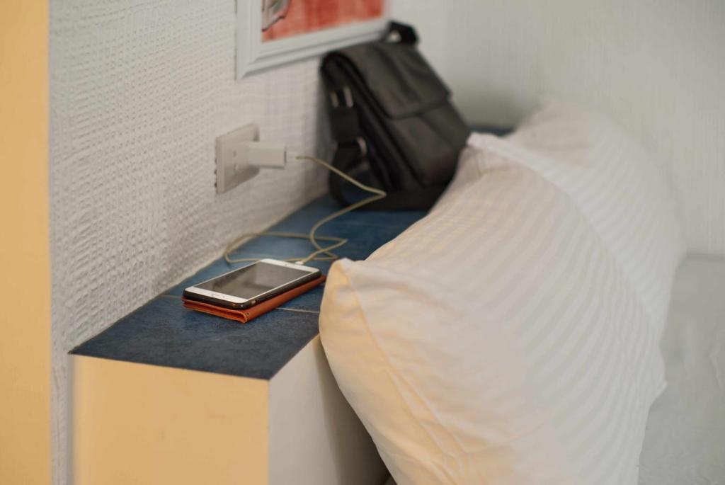 Postel nebo postele na pokoji v ubytování 1001 Nights Boutique Inn