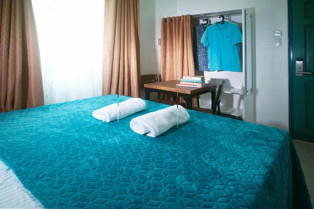 Postel nebo postele na pokoji v ubytování 1001 Nights Boutique Inn