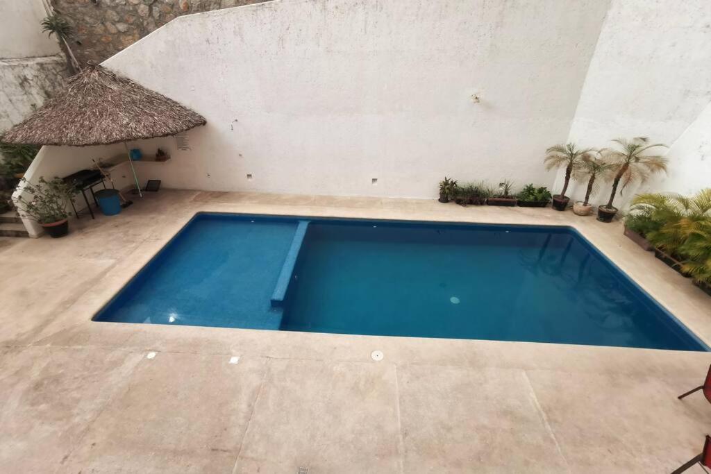 Bazén v ubytování Hermoso departamento con alberca nebo v jeho okolí
