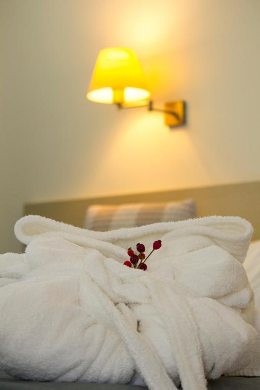 Cama ou camas em um quarto em Hotel Black Tulip - Porto Gaia