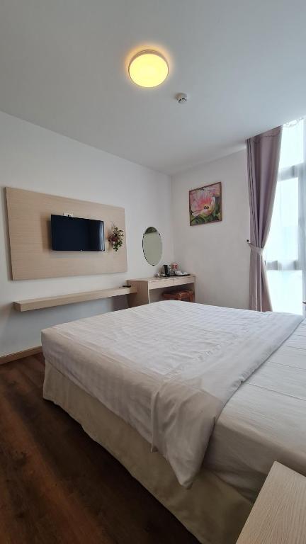 Postel nebo postele na pokoji v ubytování Ngan Hoa - Mille Fleurs