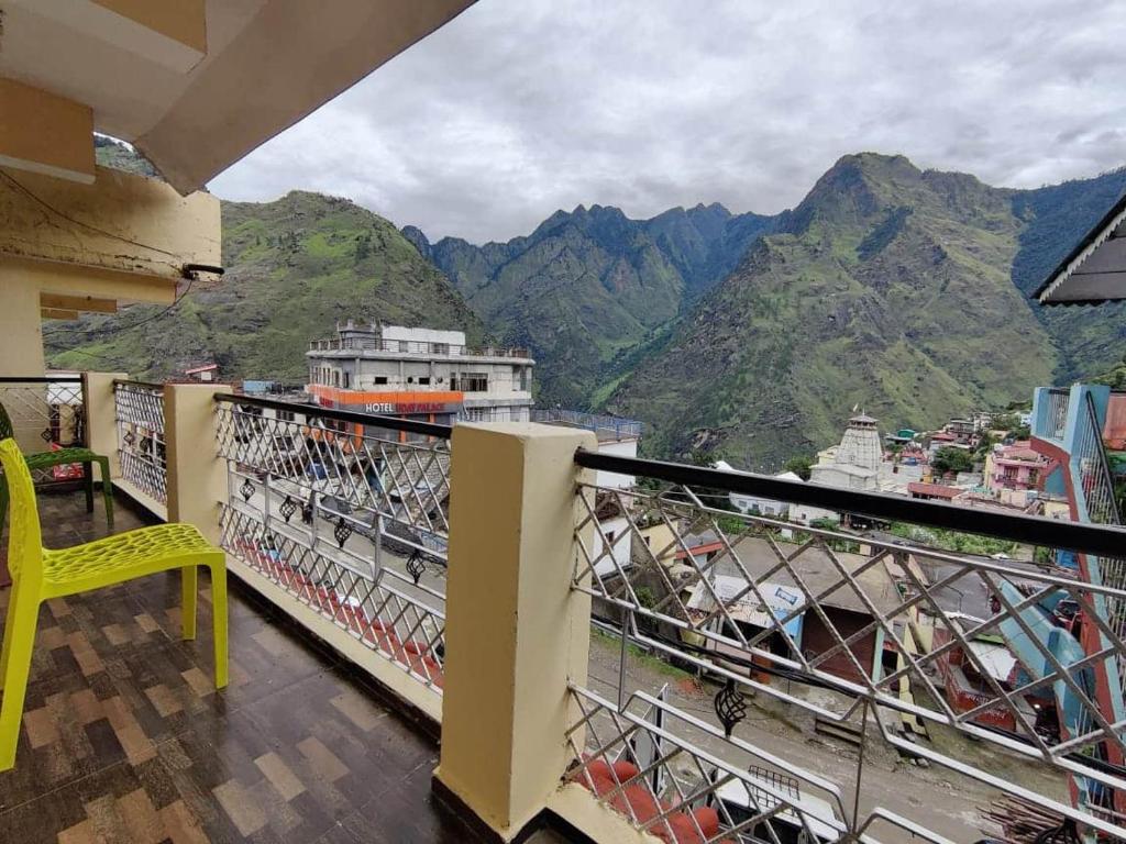 a balcony with a view of a mountain at Odyssey Stays Joshimath - Near Narsingh Temple in Joshīmath