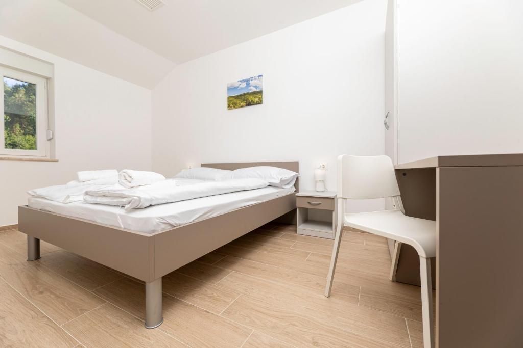 Кровать или кровати в номере Apartments Sucic 2