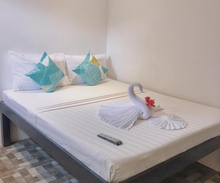 Postel nebo postele na pokoji v ubytování Palmera El Nido Inn