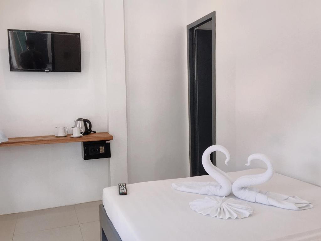 TV a/nebo společenská místnost v ubytování Palmera El Nido Inn
