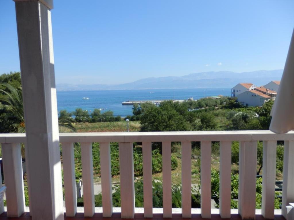a view of the ocean from the balcony of a house at Apartments Vesna & Ivica in Mirce