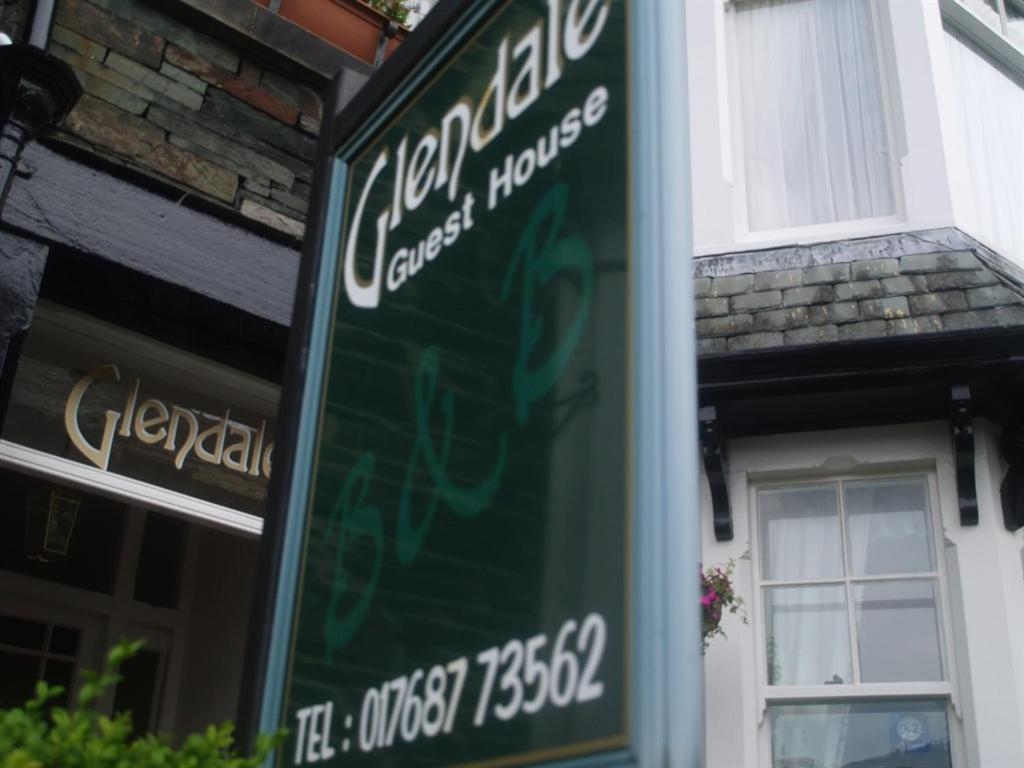 a green sign in front of a building at Glendale Guest House in Keswick