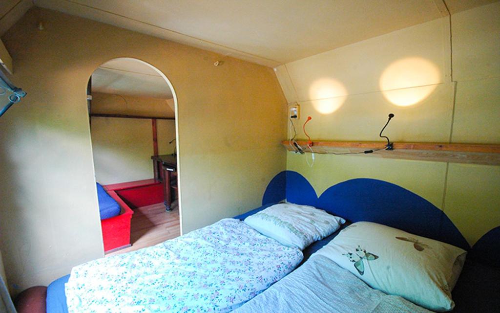 Postel nebo postele na pokoji v ubytování Sandino Summer Camp