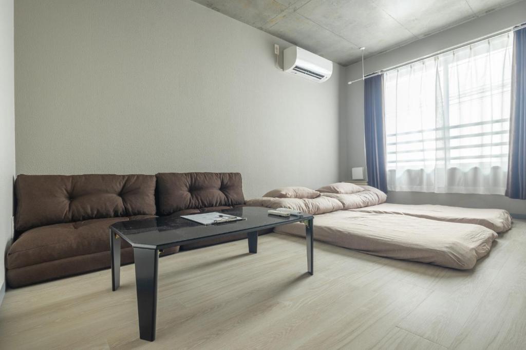 a living room with a couch and a table at Marvelous Koiwa - Vacation STAY 90651v in Tokyo