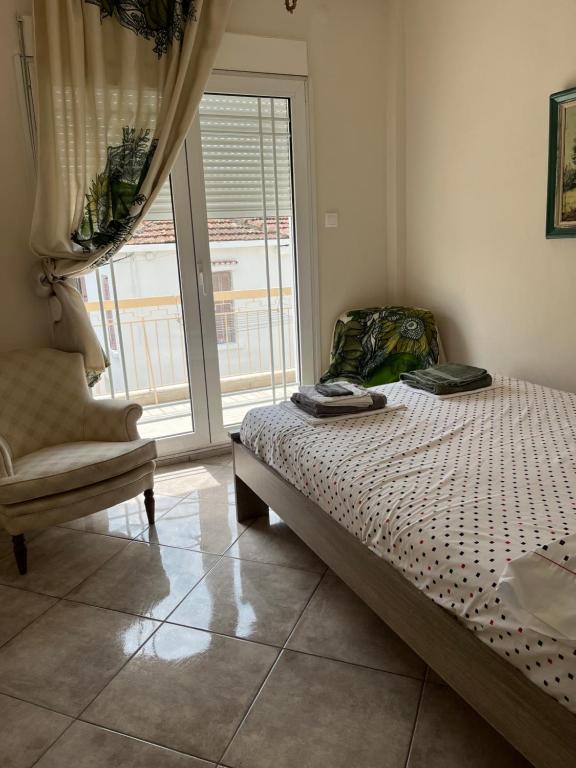 Posteľ alebo postele v izbe v ubytovaní Xronis apartments