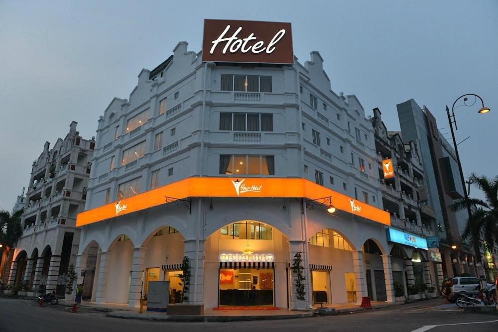 a building with a hotel sign on top of it at Your Hotel Klang by D'concept in Klang