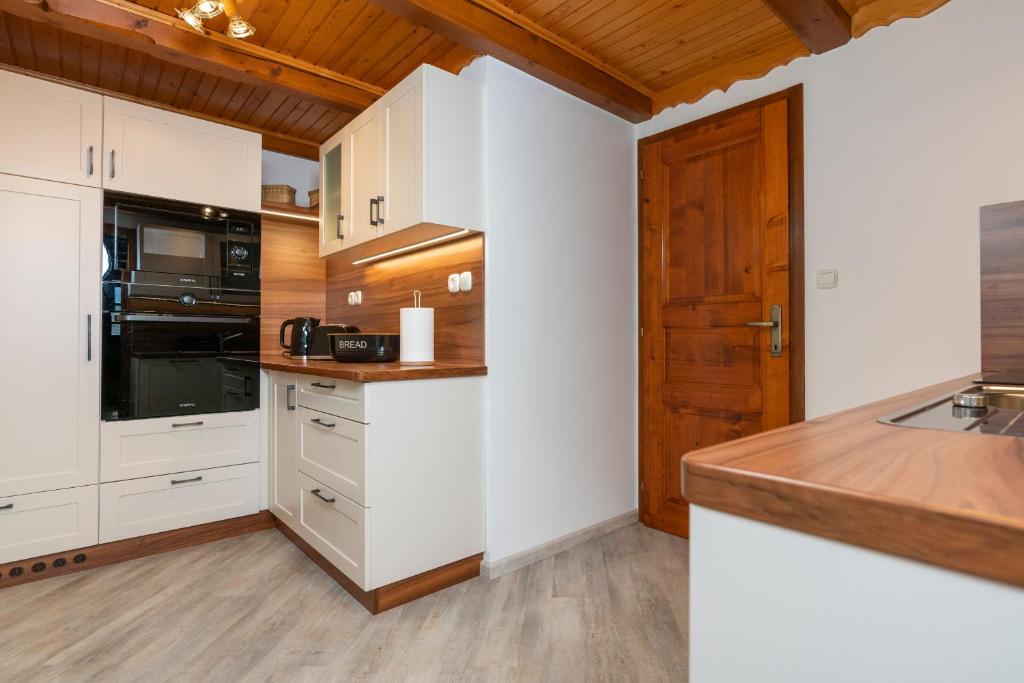 Kuchyň nebo kuchyňský kout v ubytování Chalet Ajda