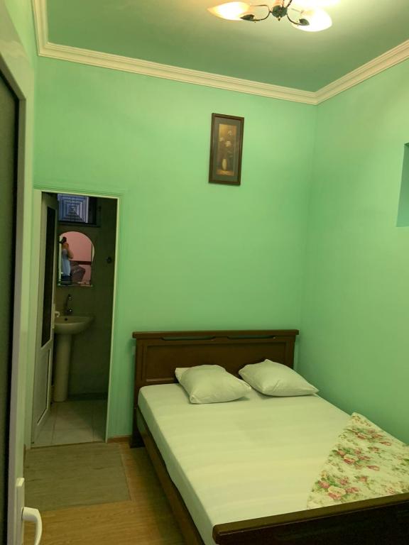 Postel nebo postele na pokoji v ubytování Tnak Hotel