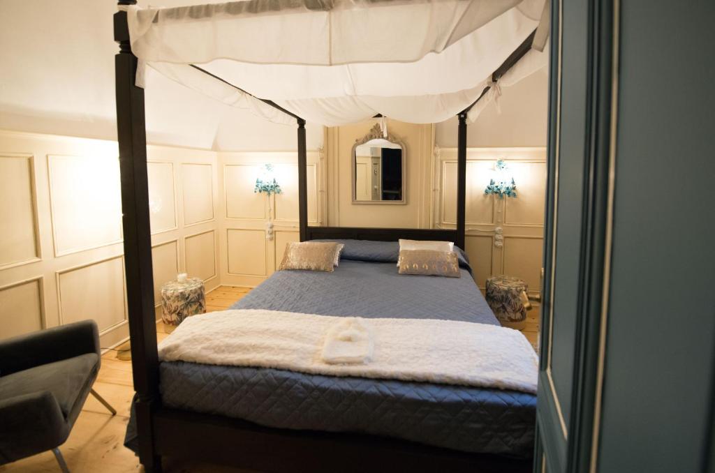 Postel nebo postele na pokoji v ubytování La Cles Deluxe Suites