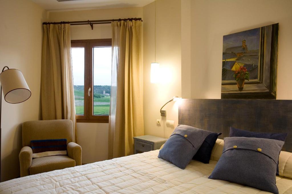 Posteľ alebo postele v izbe v ubytovaní Hotel La Vida Spa