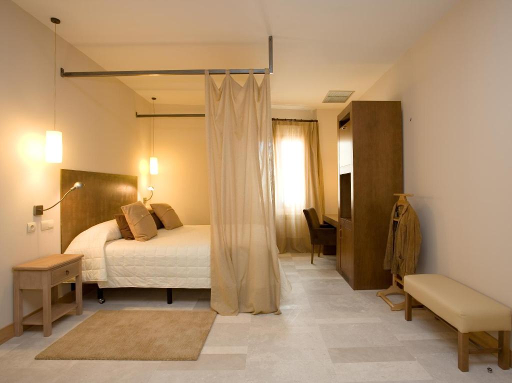 Posteľ alebo postele v izbe v ubytovaní Hotel La Vida Spa