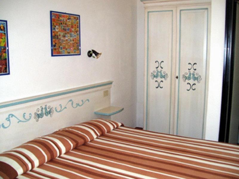 Postel nebo postele na pokoji v ubytování Hotel Nido D'aquila