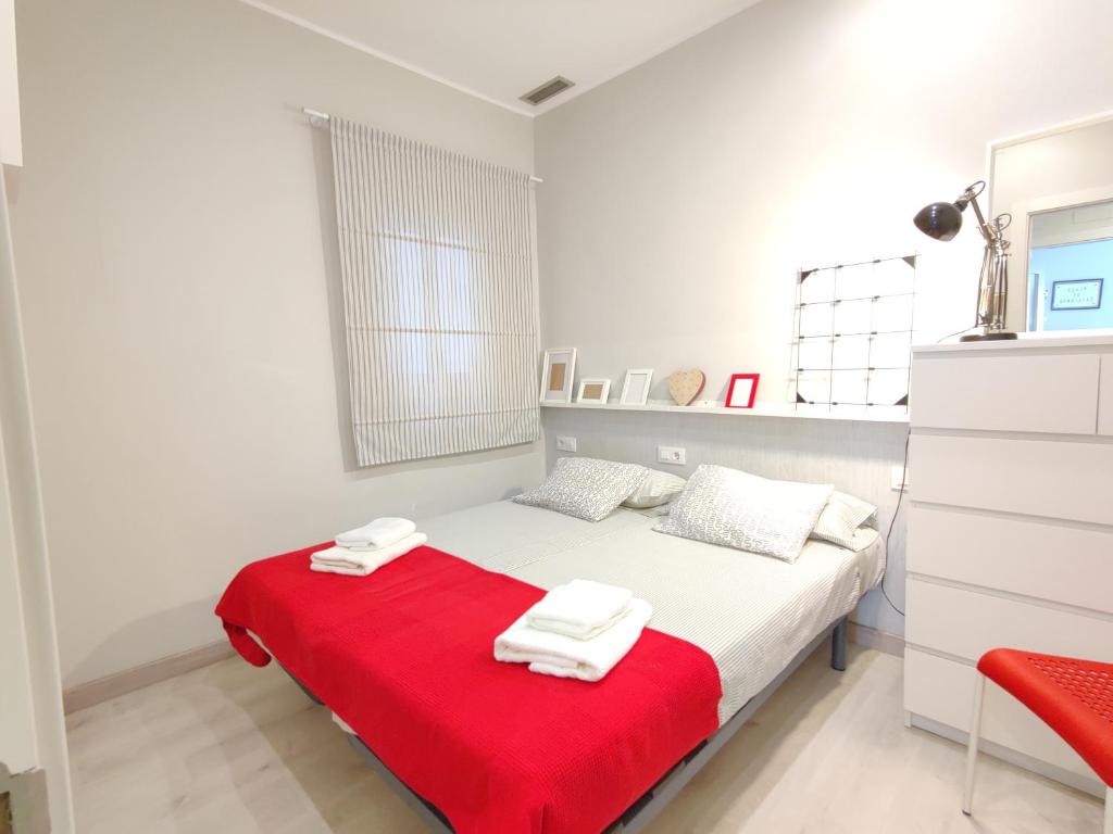 Posteľ alebo postele v izbe v ubytovaní Fira Plaza España apartment