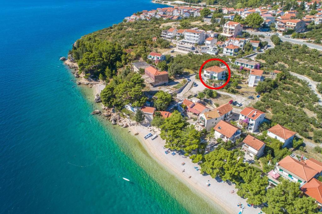 an aerial view of a house on a beach at Apartments by the sea Podaca, Makarska - 9712 in Podaca