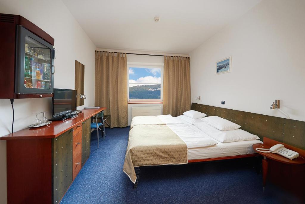 Postel nebo postele na pokoji v ubytování Hotel Horizont