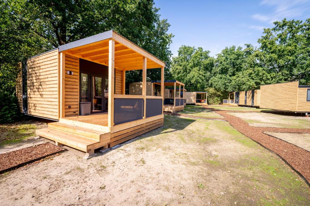 a group of modular homes in a yard at Urban Gardens Gent in Ghent
