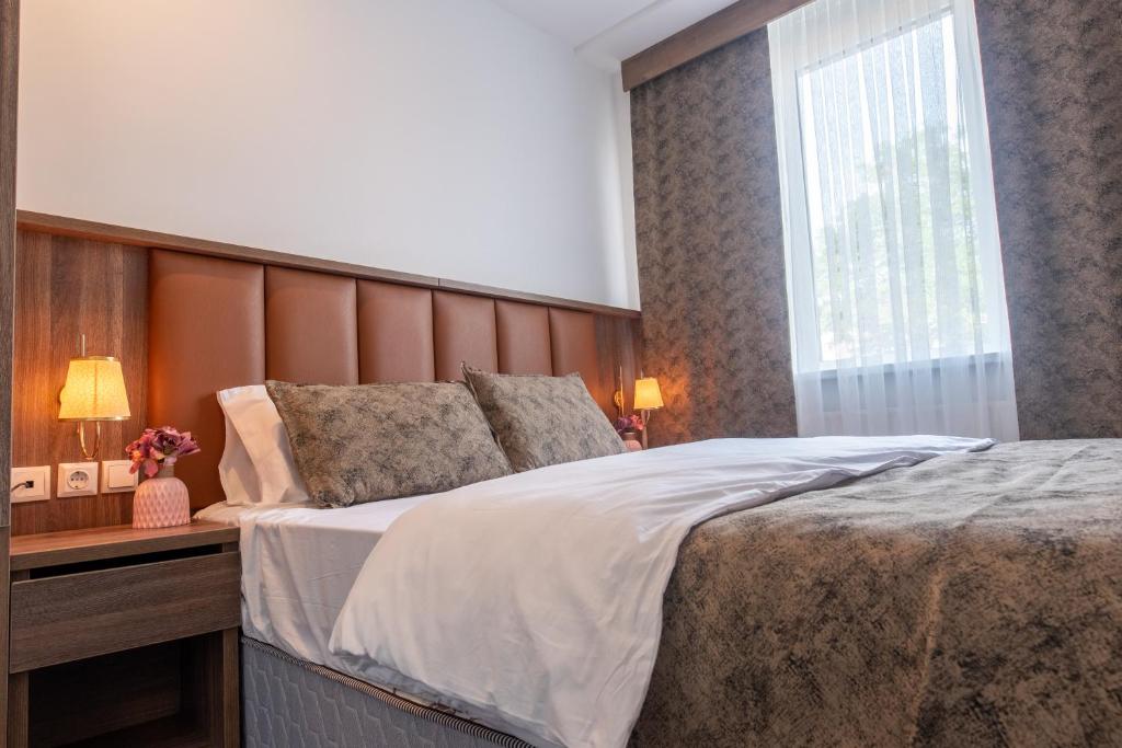 Postel nebo postele na pokoji v ubytování Hotel Cataleya