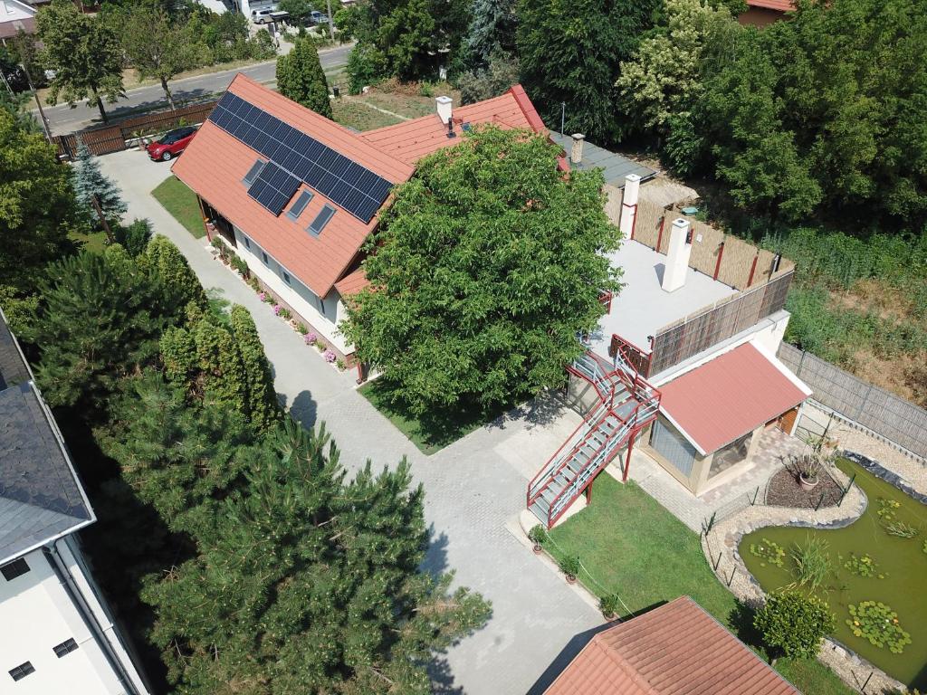 an overhead view of a house with a tree at Bor, Villa, Sóstó in Nyíregyháza