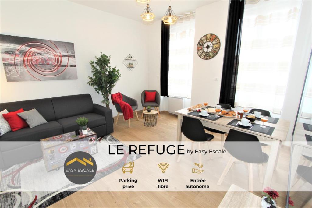 a living room with a couch and a table at Le Refuge by EasyEscale in Romilly-sur-Seine