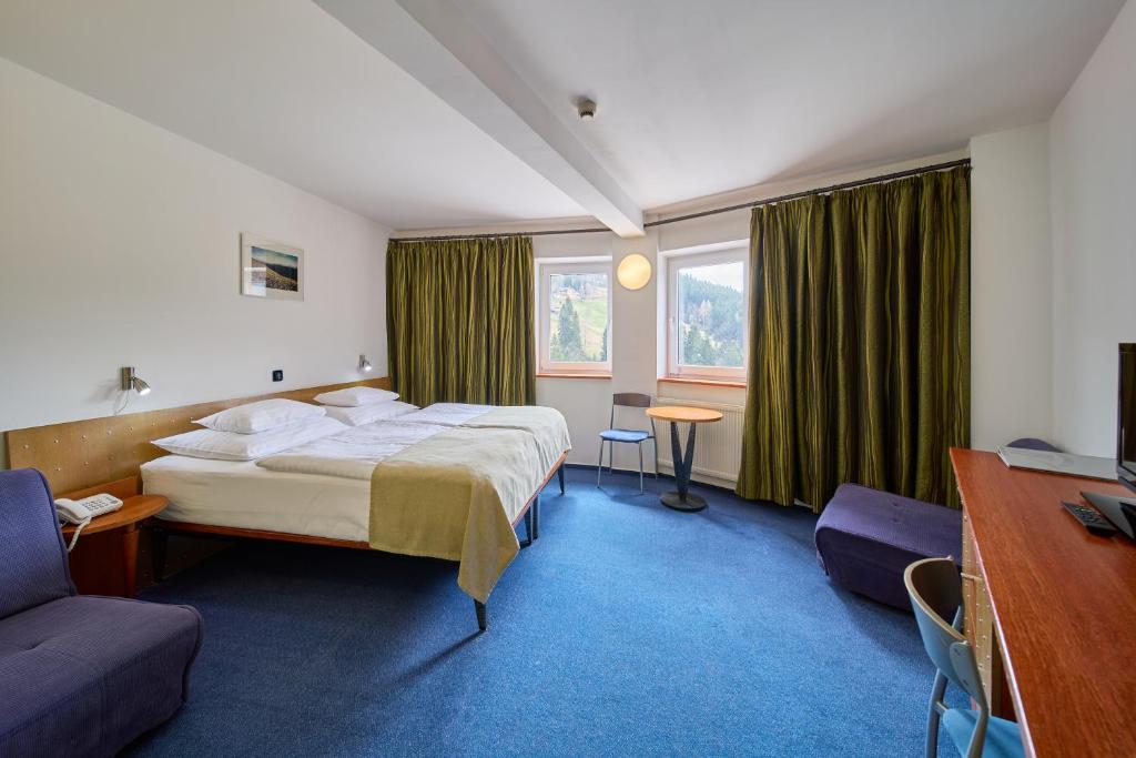 Postel nebo postele na pokoji v ubytování Hotel Horizont