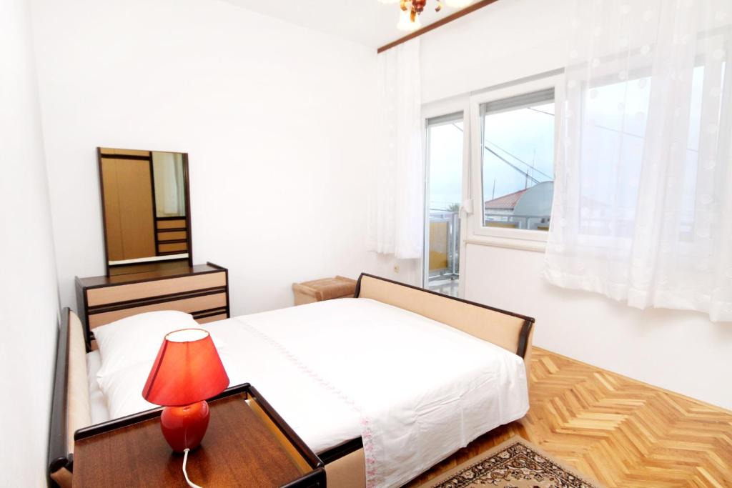 Voodi või voodid majutusasutuse Apartments by the sea Sumpetar, Omis - 2965 toas