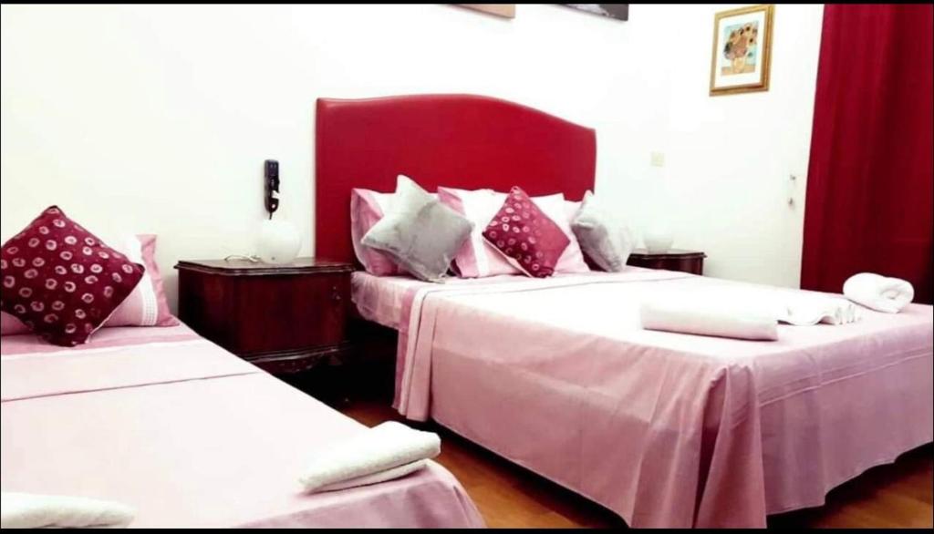 Postel nebo postele na pokoji v ubytování affittacamere sereno