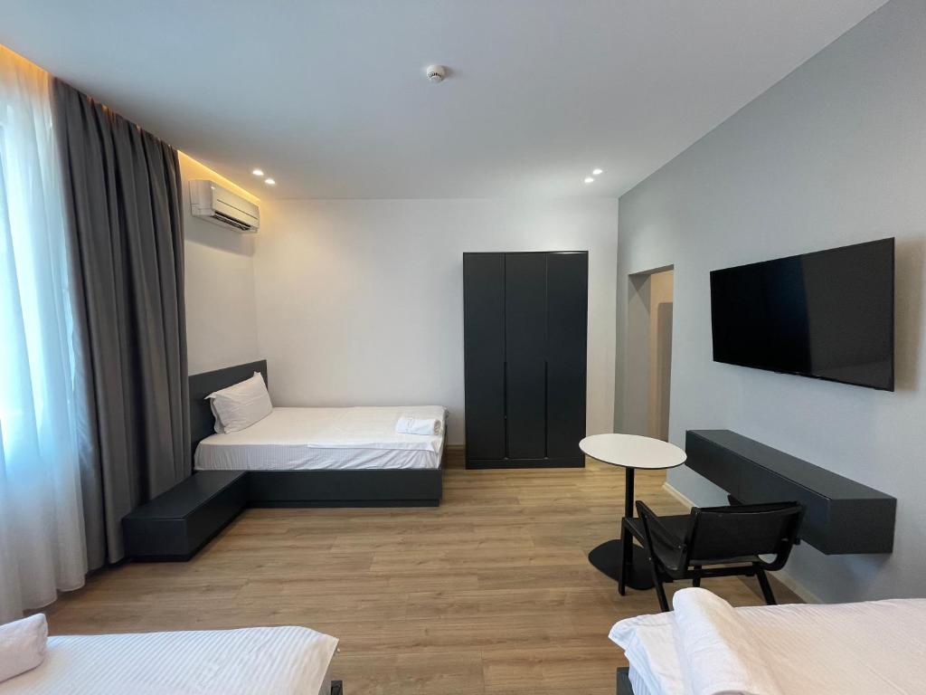 Postel nebo postele na pokoji v ubytování Ladi Rooms